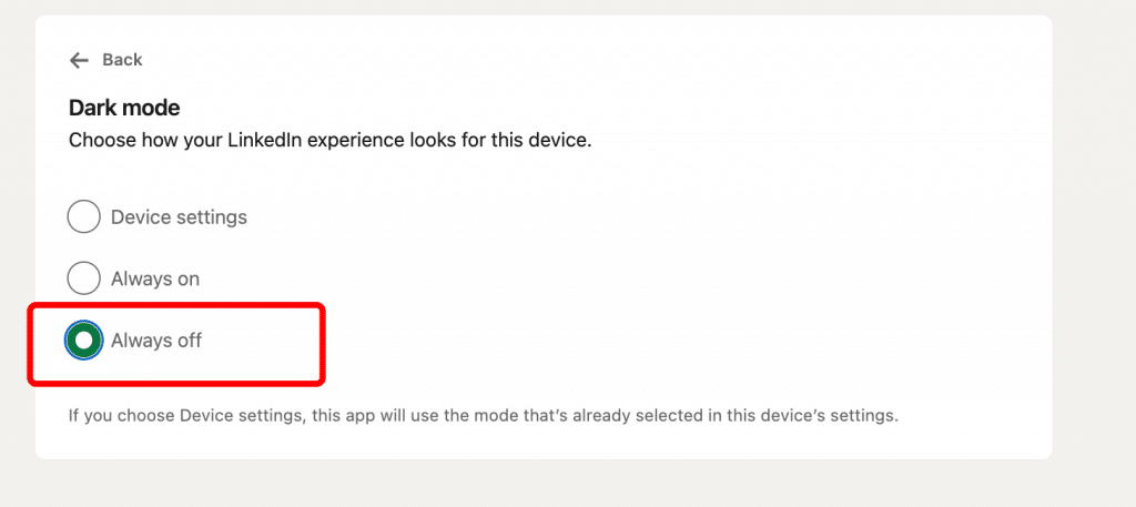 A settings menu in LinkedIn showing the option to turn off dark mode and switch back to the default light theme